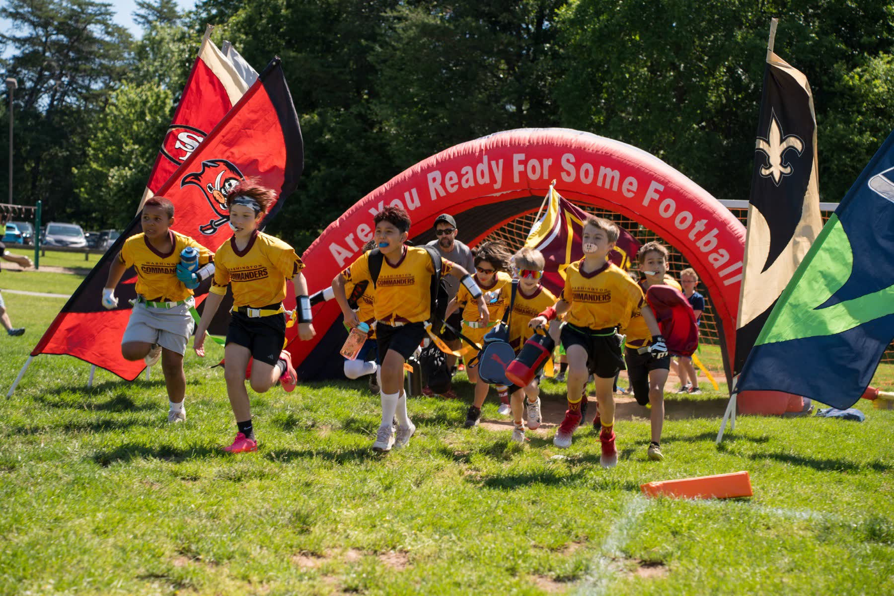 Players sprint out of the Aim High tunnel on tournament day